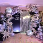 Bachelor party decoration in Gurgaon with black and gold balloons